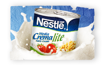 A can of Media Crema lite surrounded by a splash of table cream.