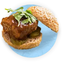 Close up of a beef slider on blue background.