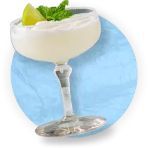 Close up frozen margarita against a blue background.