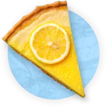 Close up of a slice of key lime pie on blue background.