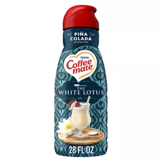 Front Center view of NESTLE COFFEE MATE Pina Colada Liquid Non-Dairy Creamer 56 fl. oz. Bottle 28 FL OZ (1.75 PT) 828 mL product.