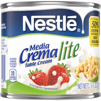 A can of Media Crema lite table cream with a green label featuring strawberries, a bowl of macaroni, and cream.
