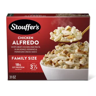 Box of Chicken Alfredo with a plate and dish of pasta below the product name, logo and "tender white meat chicken" label.