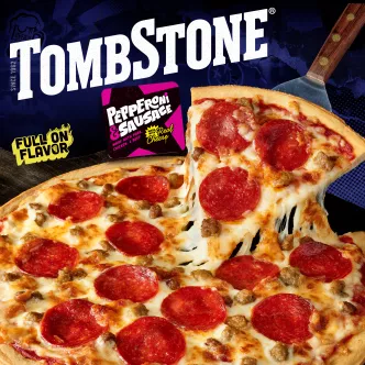 Package of original pepperoni & sausage pizza with a blue label & border, a spatula under a pizza, and the Tombstone logo.